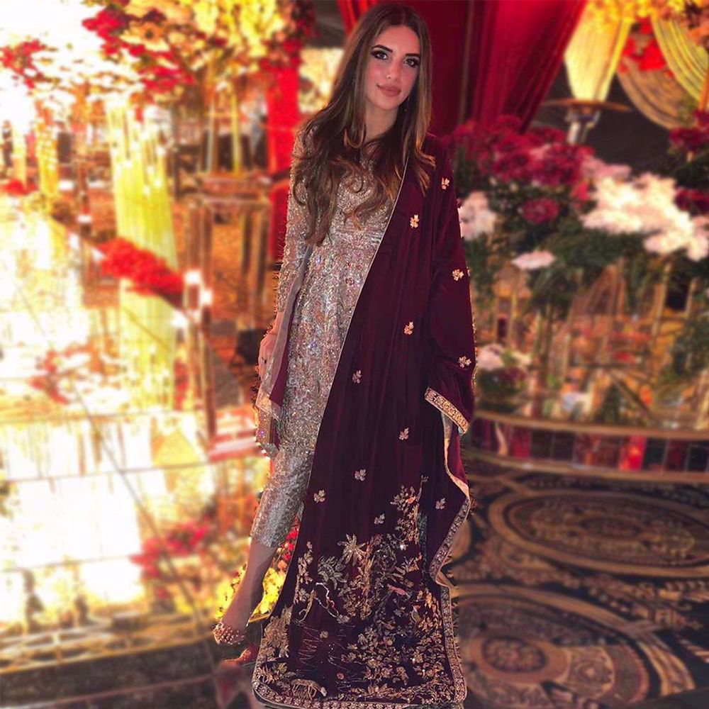 Picture of malaecahmalik donning a beautiful peplum, heavily handworked with intricate details and gleaming materials, paired with Zainab Salman’s signature shawl making it a perfect pick for this years Winter Wedding Season