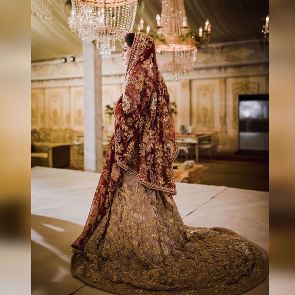 Picture of Our real bride Fatima, wearing a beautiful bridal from our exquisite collection with rich colours handcrafted motifs. A fine example of Timeless Fashion with Regal vibes
