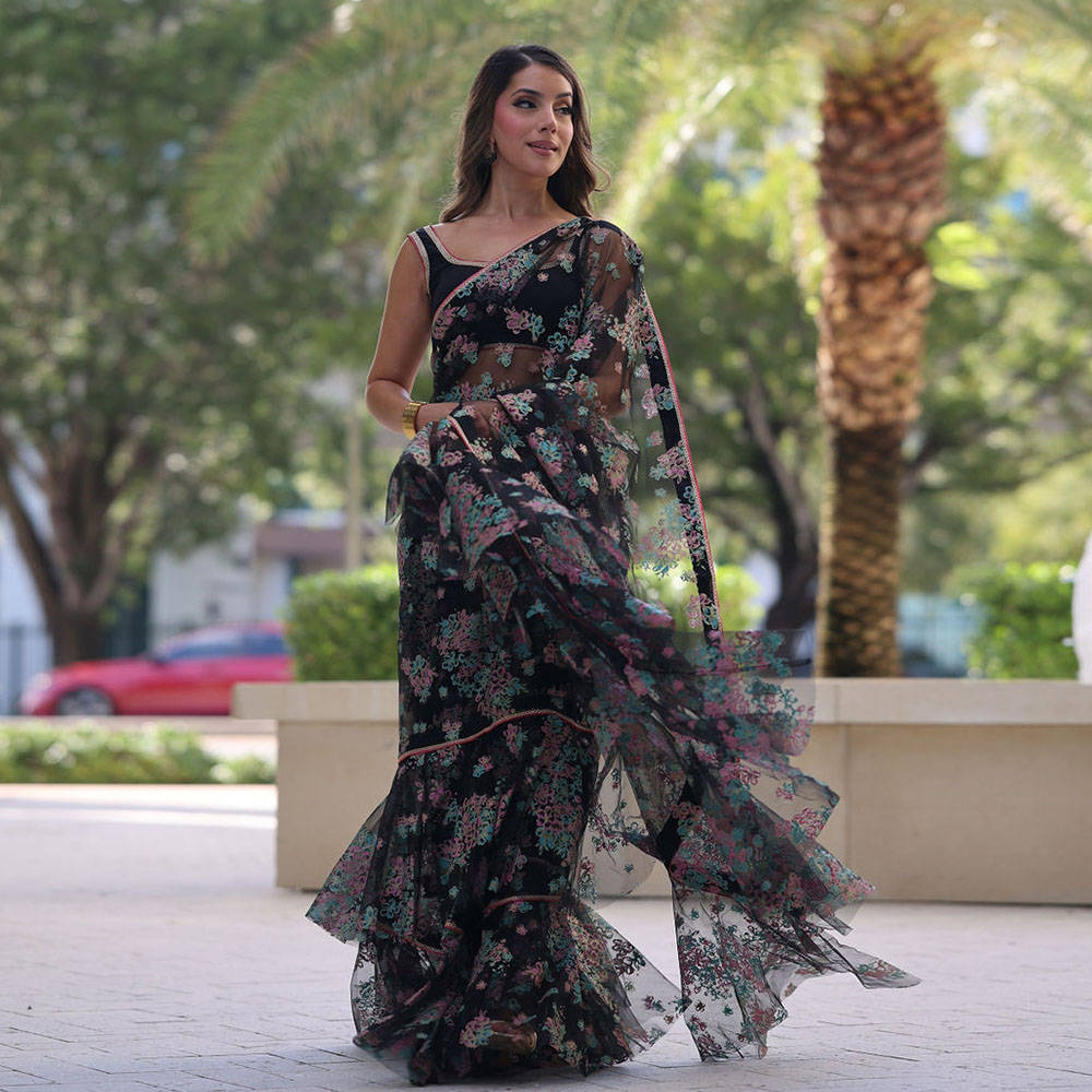 Picture of Sana khan effortlessly drapes our black floral ruffled saree