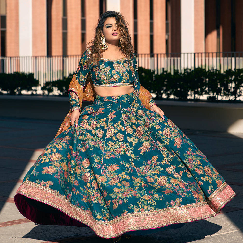 Picture of Rini Jain gracing our collection in this breathtaking teal blue raw silk printed Lehnga Choli