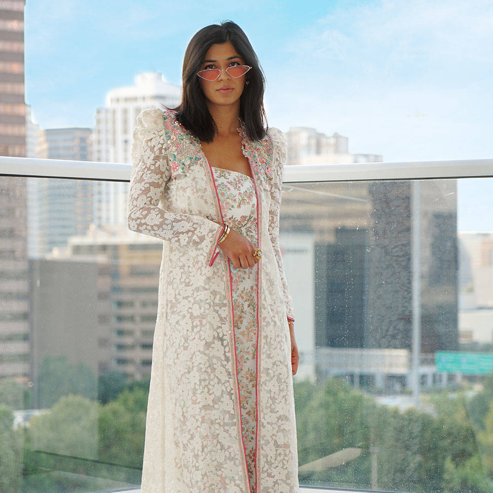 Picture of Madiha brings a touch of elegance to our alluring white organza long jacket